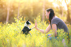 woman and Boston Terrier