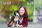 woman and Boston Terrier