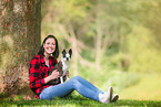 woman and Boston Terrier