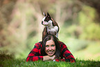 woman and Boston Terrier