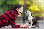 woman and Boston Terrier