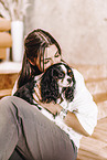 young woman with Cavalier King Charles Spaniel