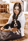 young woman with Cavalier King Charles Spaniel