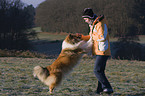 dog jump at woman