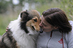 woman and longhaired collie
