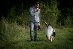 man and longhaired Collie