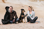 man and woman with dogs