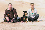 man and woman with dogs