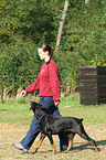 woman and Doberman Pinscher