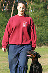 woman and Doberman Pinscher