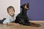 boy with Doberman Pinscher