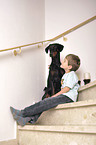 boy with Doberman Pinscher