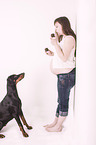 woman and Doberman Pinscher