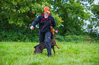 woman and Doberman Pinscher