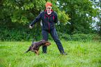 woman and Doberman Pinscher