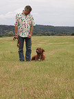 man training Bordeauxdog