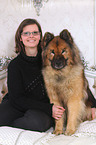 woman and Eurasian Dog