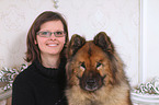 woman and Eurasian Dog