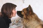 woman and Eurasian Dog