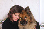 woman and Eurasian Dog