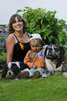 child with dogs