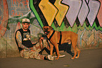 man and German Boxer