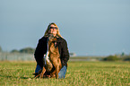 woman and German Boxer