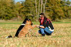 woman and 2 dogs