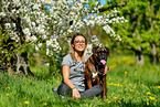 woman with German Boxer