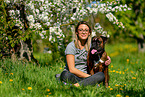 woman with German Boxer