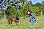 woman and German Boxer