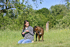 woman and German Boxer