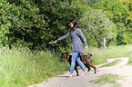 woman and German Boxer