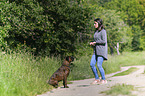 woman and German Boxer