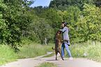 woman and German Boxer