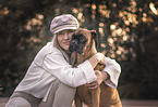 woman and German Boxer