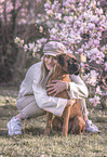 woman and German Boxer