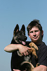 man and German Shepherd