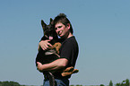 man and German Shepherd