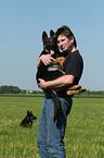 man and German Shepherd