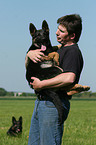 man and German Shepherd