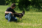 man and German Shepherd