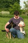 man with dog and cat