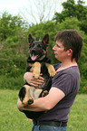 man and German Shepherd