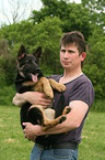 man and German Shepherd