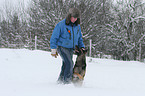 man and German Shepherd