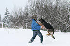 man and German Shepherd