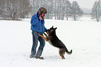 man and German Shepherd