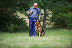 man and German Shepherd