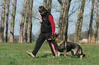 man and German Shepherd